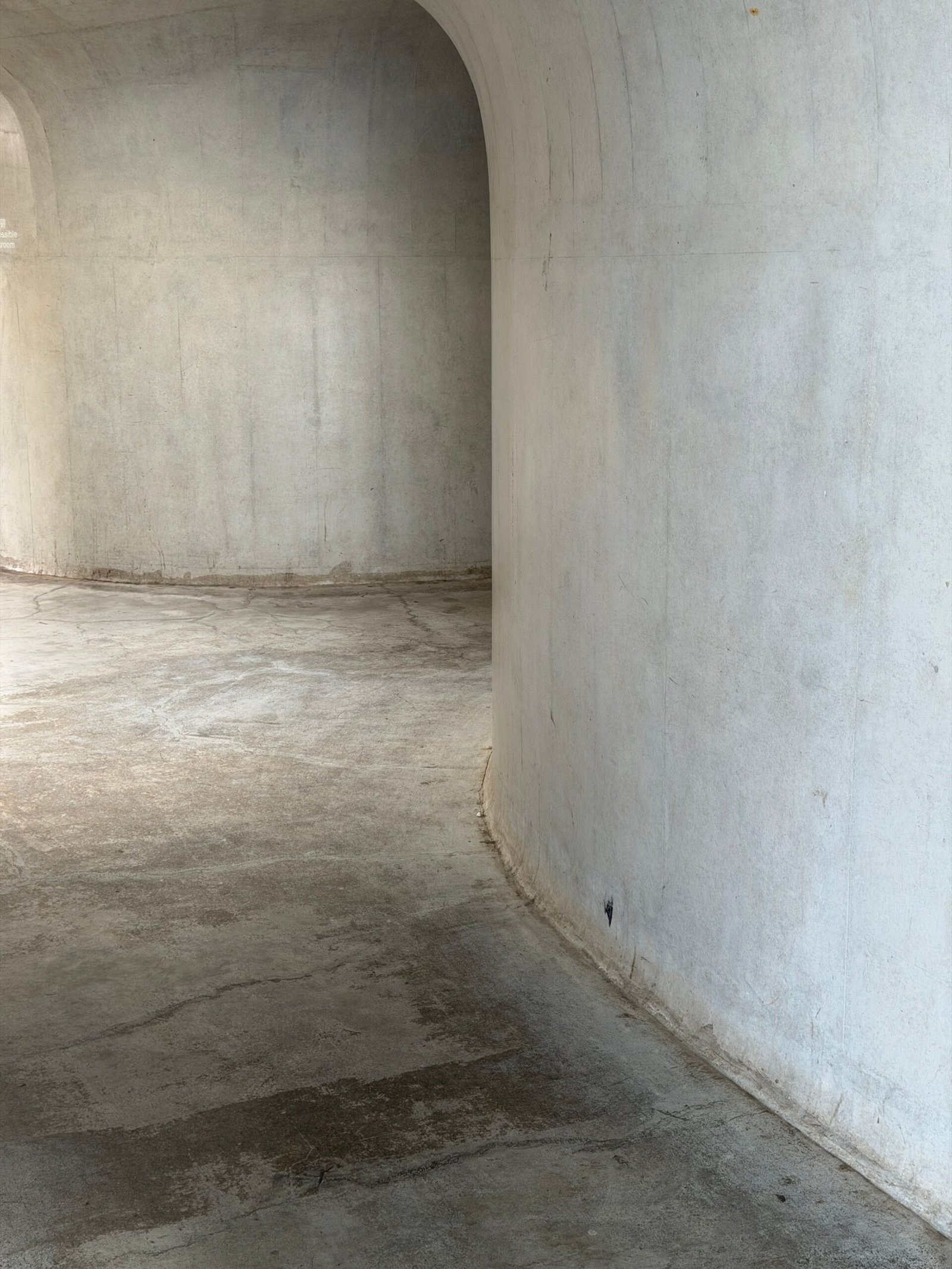 Restored smooth curved concrete wall after repair